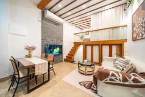 a living room with a table and a couch and a dining room at Tonight Homestay Jing'an Temple Shanghai Shenle Building in Shanghai