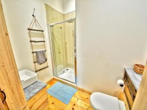 a small bathroom with a shower and a toilet at Orion - Ukc3210 in Newbridge