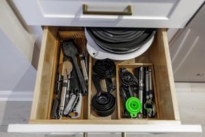 a drawer filled with cooking utensils in a kitchen at Classic City Quarters in Athens