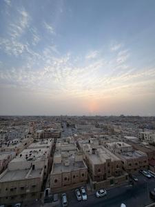 an aerial view of a city with buildings and cars at نايس فيو بانوراما للشقق الفندقية in Al Jubail
