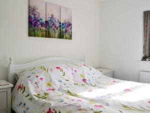 En eller flere senge i et værelse på Beach House