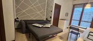 a living room with a couch and a table at Sweet Home in Garbagnate Milanese