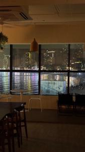 a view of a city skyline from a window at 안리하우스광안 in Kwangan-dong