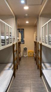 a row of bunk beds in a hospital room at 안리하우스광안 in Kwangan-dong