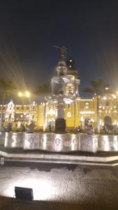 a large building with lights in front of it at night at Quechua hospedaje in Huaraz
