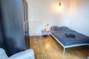 Krevet ili kreveti u jedinici u okviru objekta Le cocon des Lices - 3 bedrooms - Places des Lices