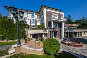 a building with a street light in front of it at Erla Villa Boutique Hotel in Eger