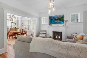 a living room with a couch and a fireplace at SaraCasa - First Floor House 2Br/1.5Bath in St. Augustine