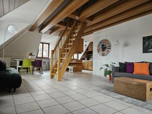 a living room with a couch and a table at Ferienwohnung 2 ANNA IFF in Würzburg