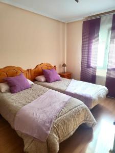 En eller flere senge i et værelse på Amanecer en Playa de LLás