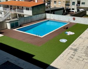 an overhead view of a swimming pool on top of a building at Imperial Beach House in Vagos