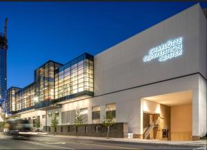 a building with a sign on the side of it at Stylish & Cozy Retreat with Backyard & Parking in Charlotte