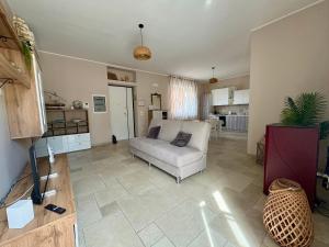 a living room with a couch and a table at Villa Raffaele in Trani