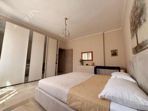 Postel nebo postele na pokoji v ubytování Villa Raffaele