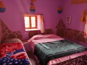 Postel nebo postele na pokoji v ubytování Auberge Tafouyt