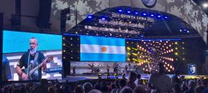 a large stage with a man on the stage at Departamentos Mariano in Cosquín