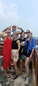 a group of women posing for a picture at Shri Gopinath In in Varanasi