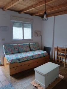 Ένα ή περισσότερα κρεβάτια σε δωμάτιο στο A Casiña de Morgan, Refugio con alma en el corazón de Galicia