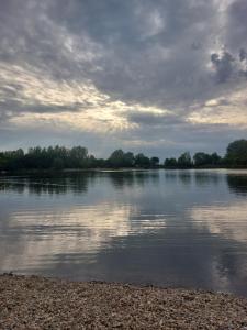a body of water with a cloudy sky at Rajj in Bela Crkva