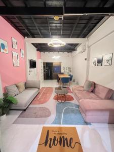 a living room with a couch and a table at LA CASA in China town in Bangkok