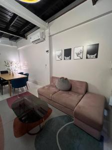a living room with a couch and a table at LA CASA in China town in Bangkok