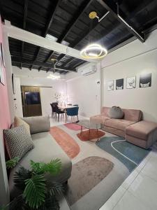 a living room with a couch and a table at LA CASA in China town in Bangkok