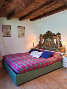 Ένα ή περισσότερα κρεβάτια σε δωμάτιο στο Maso Tre Cucù by Go New Location