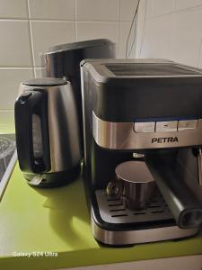 a coffee maker sitting on top of a green counter at Vienna breeze1 in Vienna +10 photos