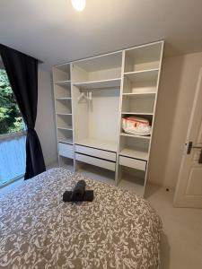 a bedroom with a bed and a book shelf at L'ancrage in Saint-Brieuc
