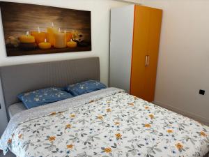 a bedroom with a bed and a painting on the wall at Medore Hotel & Next to the Beach in Canakkale