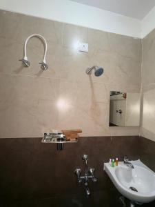 Ένα μπάνιο στο Tarini Comforts SGR Dental College Road Marathahalli