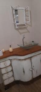 a bathroom with a sink and a mirror at Cheiro de Flor - Gamarra in Baependi +35 photos