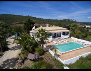an aerial view of a house with a swimming pool at casa do lago in Monchique