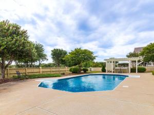 a swimming pool in a yard with a fence at 1812 - The Original Sound and the Fury in Poplar Branch +96 photos