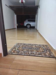 a hallway with a rug on the floor in a parking garage at Villa Molina Del Mar in Arecibo