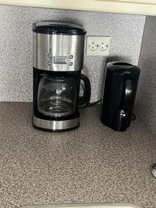 a coffee pot sitting on a counter next to a coffee maker at Franciscus in Bergen op Zoom