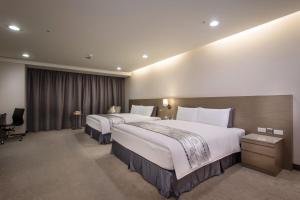 Postel nebo postele na pokoji v ubytování Zhong Ke Hotel