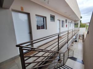 a staircase leading to the second floor of a building at Studio - Ótima localização Mobiliado in Barretos