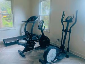 a gym with three exercise bikes in a room at Lin Wood Retreat in Plainfield