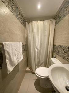 a bathroom with a toilet and a sink at Cairo Nomads Hostel in Cairo