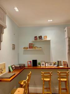 a room with a counter with chairs and a desk at Cairo Nomads Hostel in Cairo
