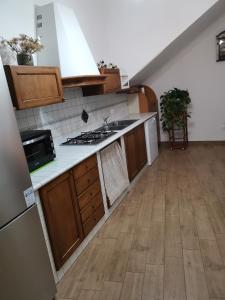 a kitchen with a sink and a stove at Dimora Visconti in San Demetrio neʼ Vestini