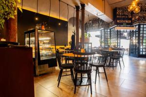 a dining room with tables and chairs in a restaurant at Cozy Main Square Apartment II with Breakfast in Košice