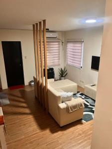 a living room with a couch and a chair at Cana Blessed Guest House Amaia 