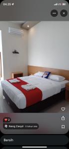 Ένα ή περισσότερα κρεβάτια σε δωμάτιο στο Hotel Setuju