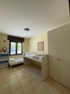 Postel nebo postele na pokoji v ubytování Villa Colline Fiorite