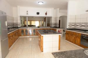 Kuchyň nebo kuchyňský kout v ubytování Grann Kaz Guest House