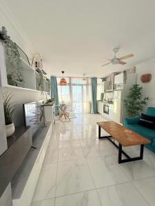 a living room with a couch and a table at Sea view Nice apartament in Ocean View in Adeje