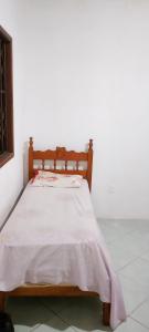 Ένα ή περισσότερα κρεβάτια σε δωμάτιο στο Casa de temporada