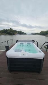 a hot tub sitting on the deck of a boat at Prestige Yacht Resort Budapest in Budapest +48 photos